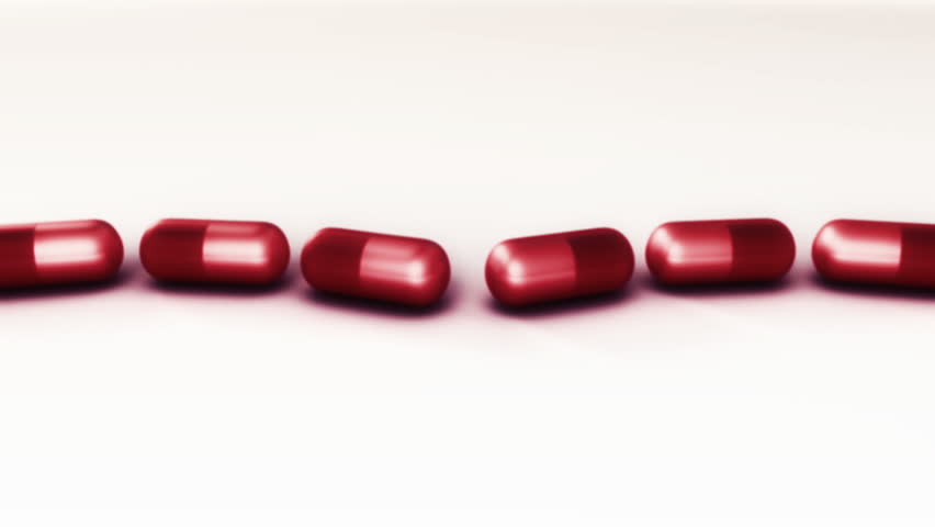 Intentionally more glow and blurred 3D animation explosion. Heart shape is made of pills. Concept for different kind of medicine issues. At the end all pills gone.