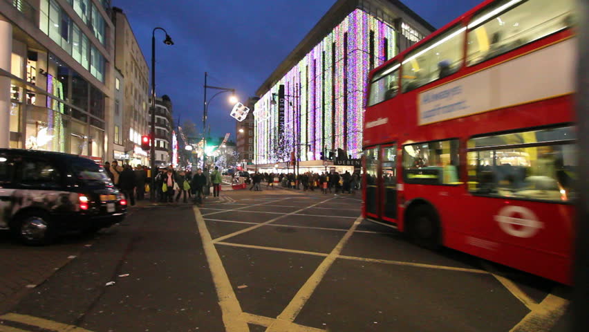 LONDON, UK - DECEMBER 27: Busses and other traffic drive beneath Christmas lights on Oxford Street on December 27, 2011 in London, UK. Oxford Street is one of the main shopping streets of London.