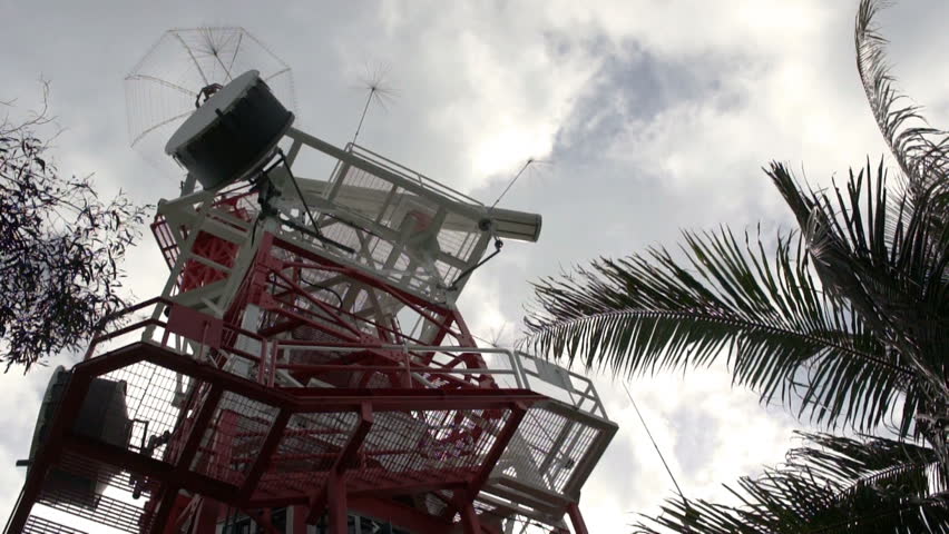 A red and white steel structured Communication tower.