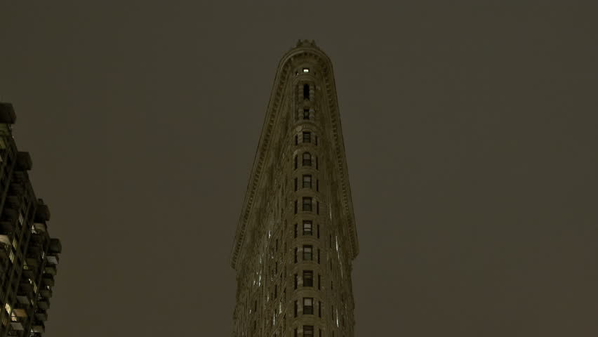 NEW YORK CITY - Feb 10: Timelapse of the Flatiron Building at nighttime on February 10, 2012 in New York City, USA. Flatiron building is considered to be one of the first skyscrapers ever built. 