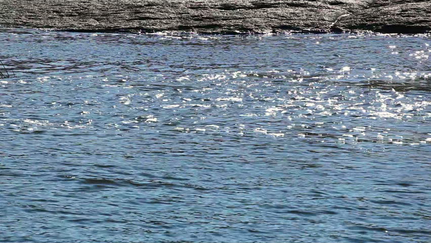 Watercourse with rocky coast and brilliant water