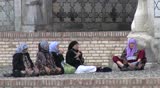 SAMARKAND, UZBEKISTAN - MAY 22: Women in prayer outside the Bibi Khanym mosque on May 23, 2010 in Samarkand, Uzbekistan. Despite Soviet atheism, Sufi Islam has survived. 