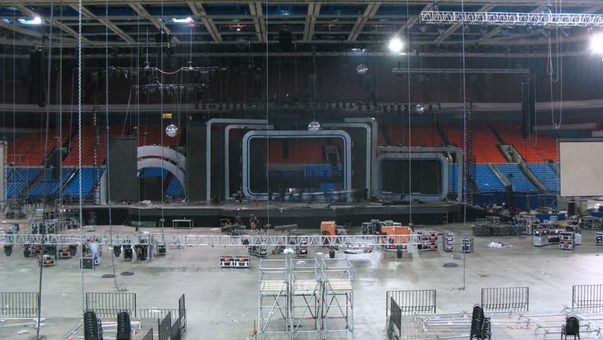 Workers dismantled an inscription and remove lighting and projectors, time lapse