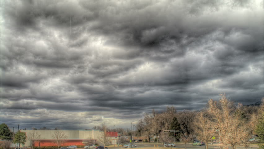 Time lapse of clouds above city