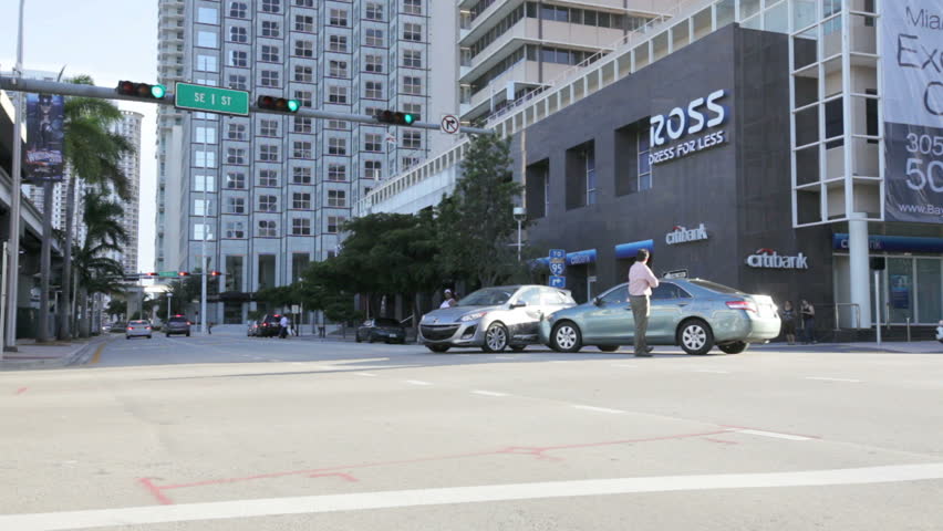 MIAMI, FL - MARCH 16: Man standing by his car after a collision in the middle of the street on June 16, 2012 in Miami, FL.