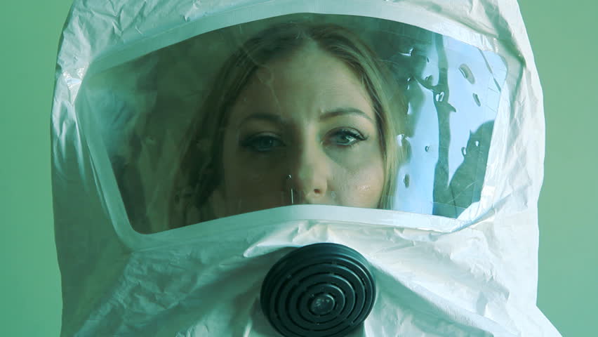 Young woman wearing environmental safety suit.
