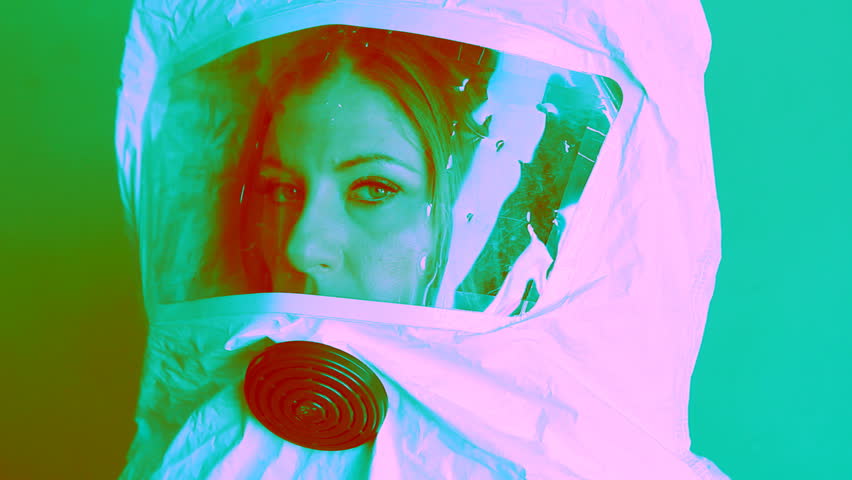 Young woman wearing safety suit. Three quarter view. Psychedelic colours.