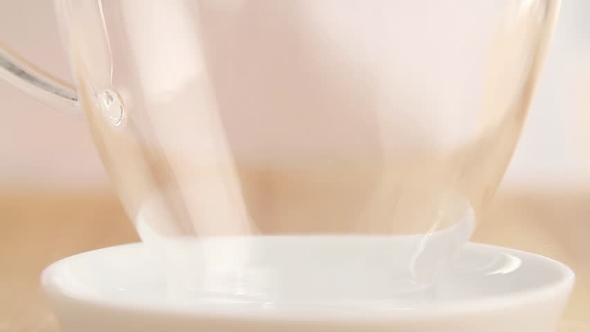 Vanilla sauce being poured into a sauciere