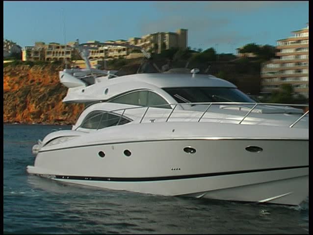 Motoryacht approaching harbor, clip 1