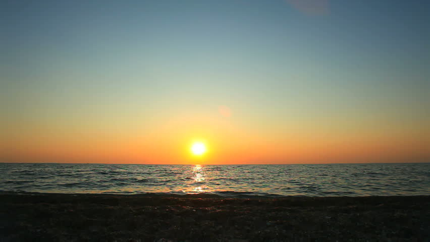 Little girl is walking in the beach.
Little girl is walking in the  beach on sunset background.