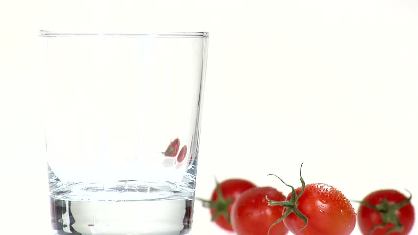 Pouring tomato juice into a glass