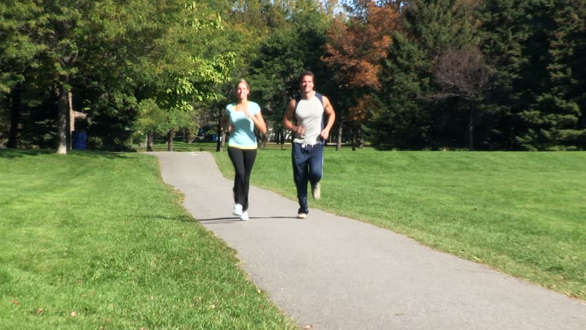 Jogging happy couple. Sport and fitness.
