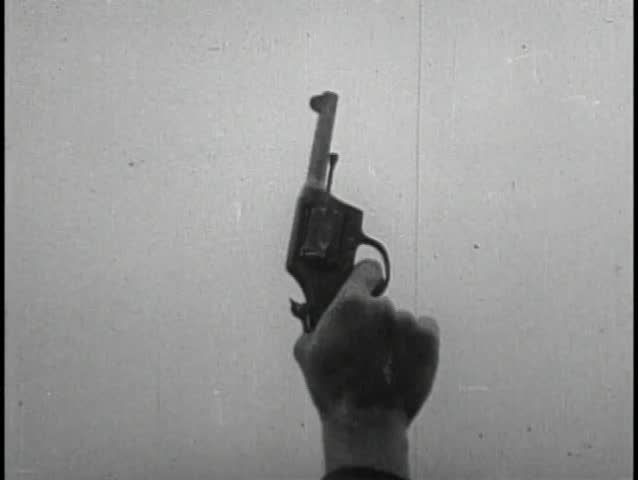 Medium shot of hand shooting handgun