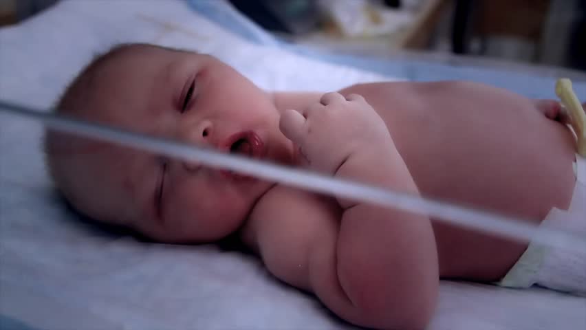 A newborn baby at the hospital born just minutes before being cleaned by the nursing staff.