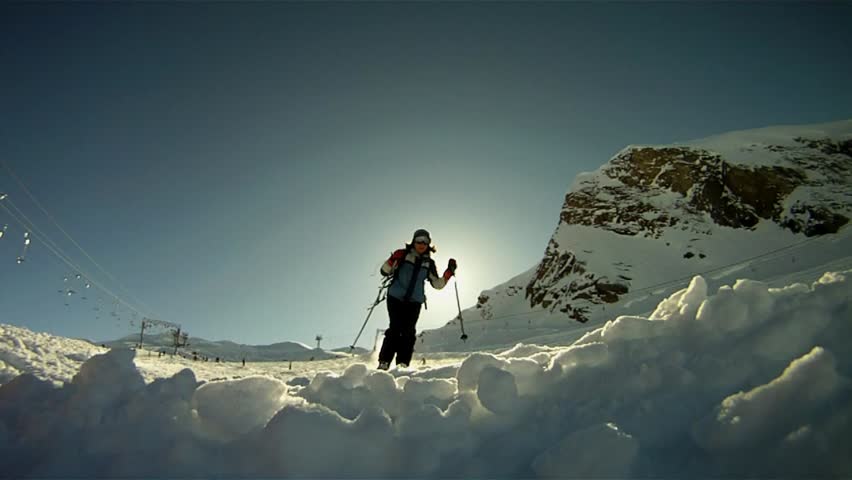 Slow motion of a skier skiing down the slope
