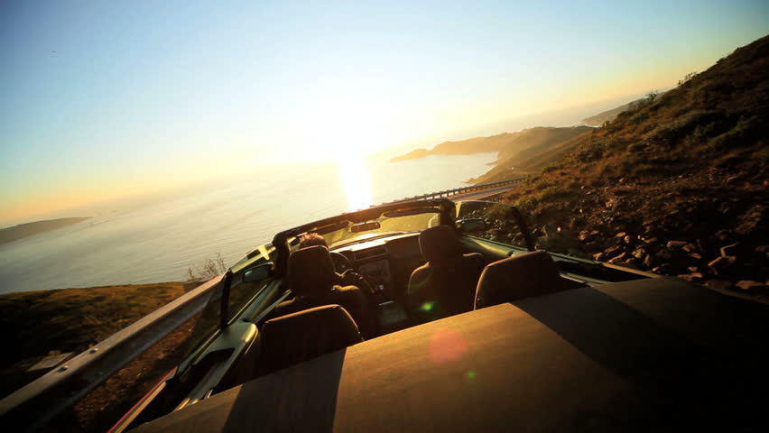 Dream vacation road trip in a red Cabriolet convertible