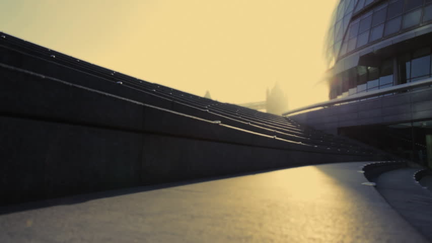 Runner on steps City hall London, UK, Slow motion, PAN up, wide shot