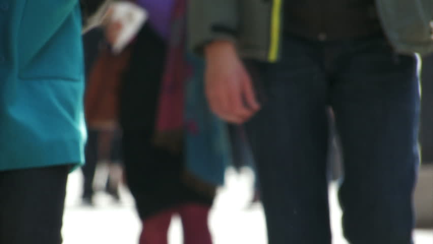 De-focused people walk in slow motion 2