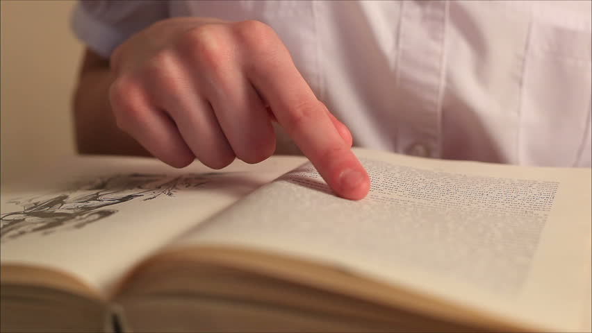 child reads a book