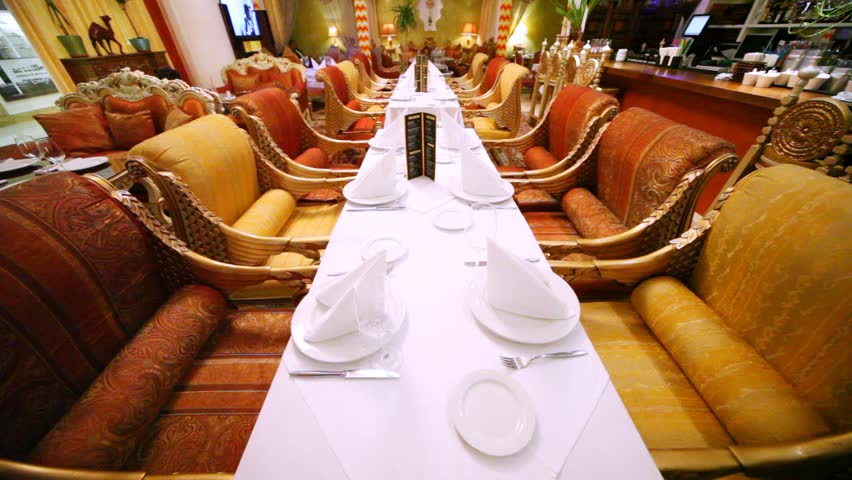 Decorated tables stand in center of lounge of east restaurant