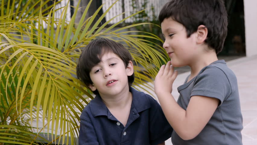Boys Tell Secrets (HD). Two brothers of Hispanic origin; six and four years old telling secrets to each other.