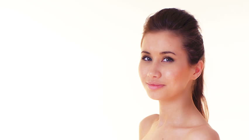 young woman with naked shoulders drink water, over white background