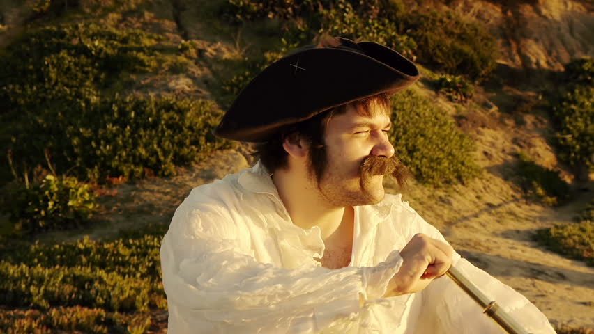 Pirate With Spyglass (HD). Pirate with white shirt looking at an objective with a vintage spyglass at sunset.