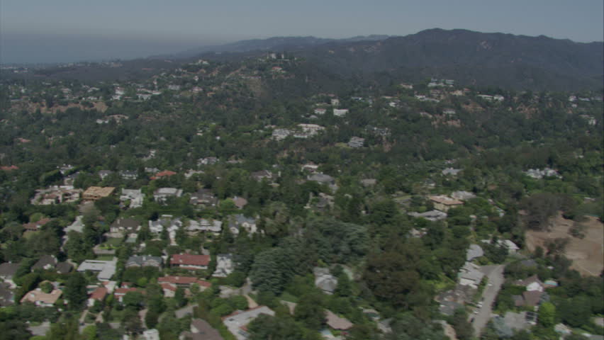 aerial flying shot of upscale, lanscaped suburban area circa 2009