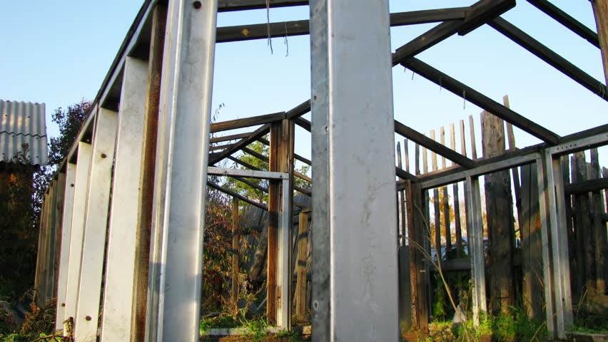 Dismantled greenhouse dolly shot time lapse in late autumn