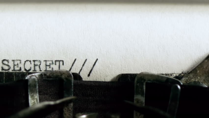 Typing TOP SECRET (HD). TOP SECRET being typed and centered on Vintage 1940s typewriter. Ambient audio Included.