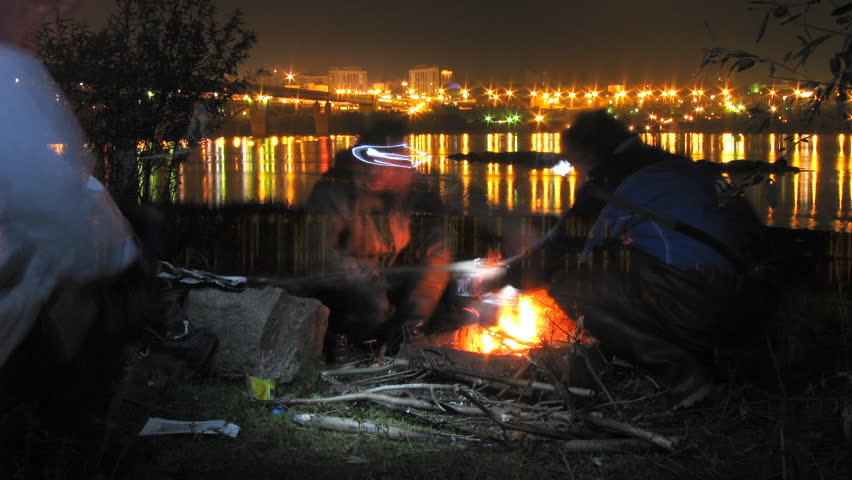 River lights time-lapse series Fishermen cook fish soup 