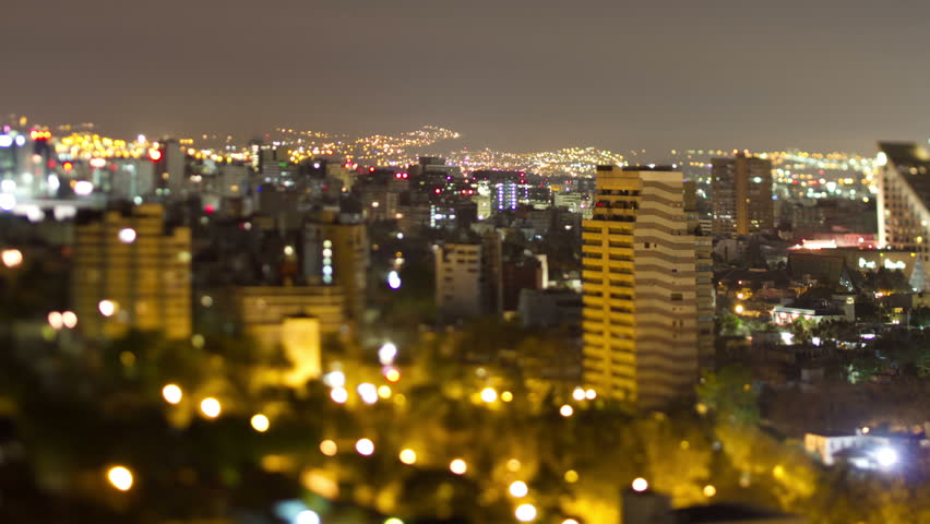 a time-lapse of the mexico city skyline at night