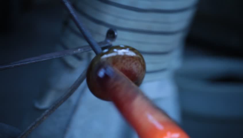 Glass workshop. Studio glass sculpture making. Atelier. Camera raw footage.