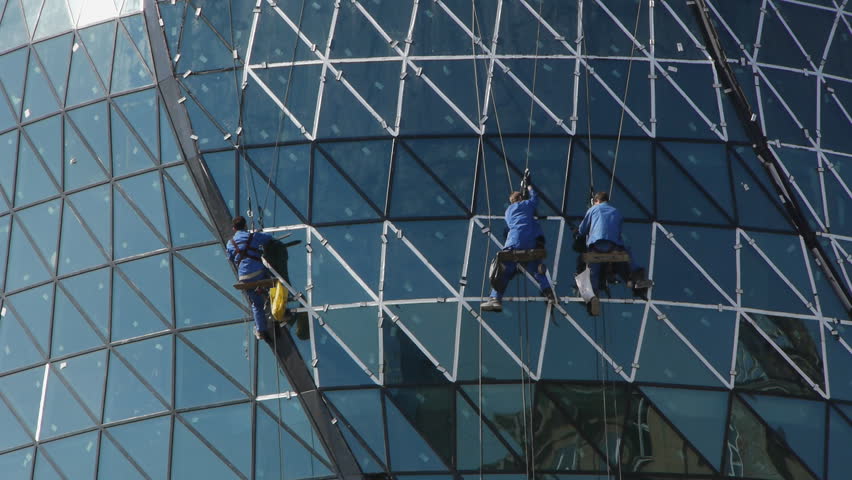 Modern building under construction. Builders on the scaffolding. Novosibirsk, Russia.