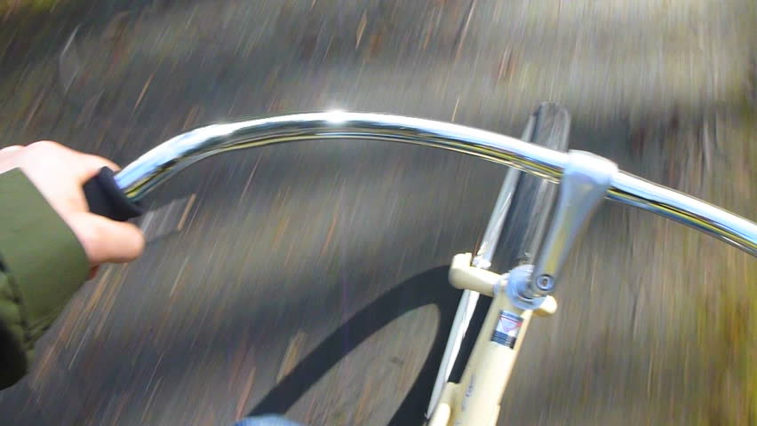 Point of View while riding bicycle on paved trail.
