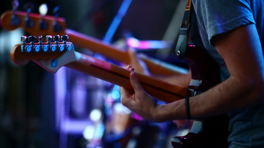 Guitars in live action at a concert (rack focus)