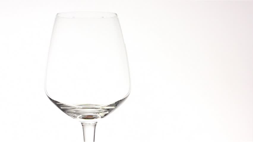 Red wine pouring in slow motion