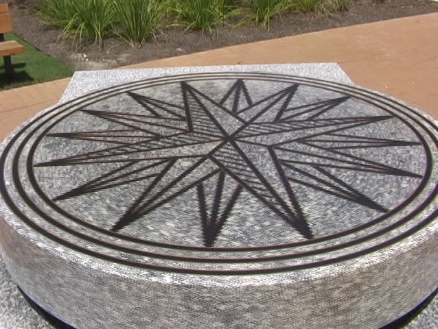 A large rotating stone with an emblem rotates slowly.