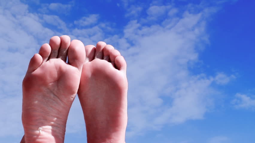 Summer vacation - feet with sky time lapse