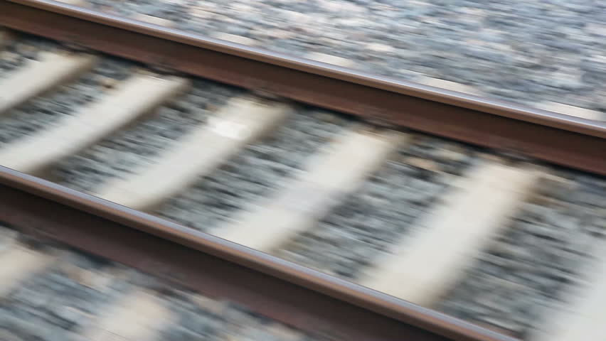 Close view of railroad track moving at high speed