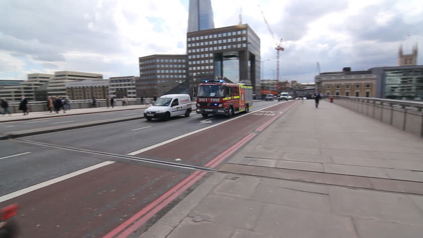 LONDON, UK APRIL 2nd: Emergency vehicles on April 2nd, 2012 in London. Two shots. One of a fire engine passing by and one of a stationary ambulance.