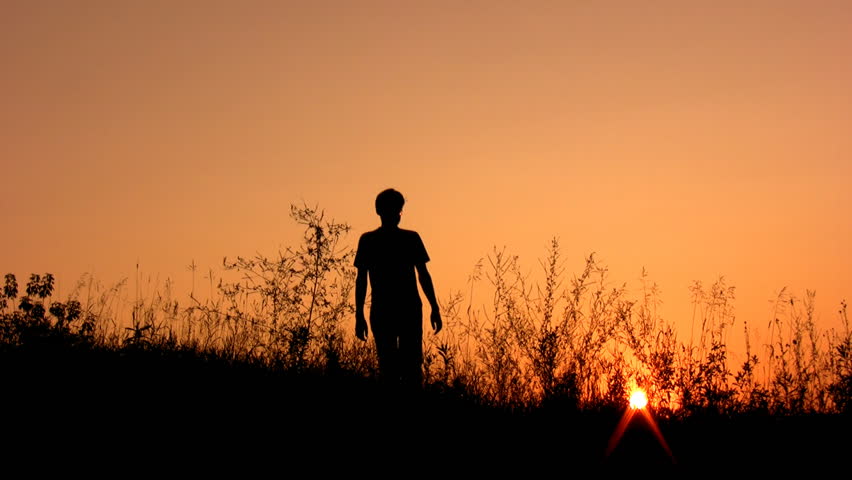 walking man silhouette on sunset sky alone 
