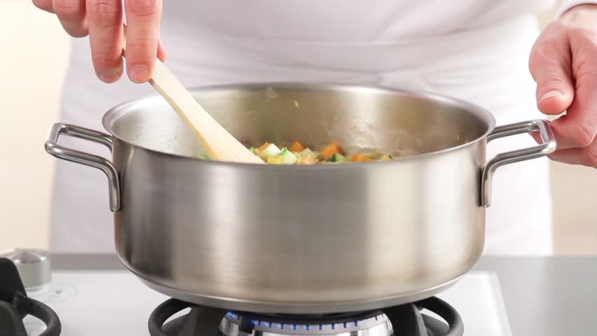 Stirring lentil stew
