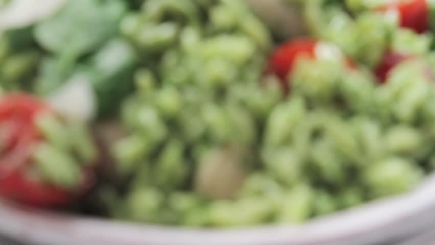 Chicken and orzo salad sprinkled with freshly grated Parmesan