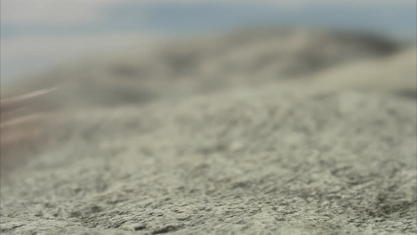 Feet walking on cliffs, close-up
