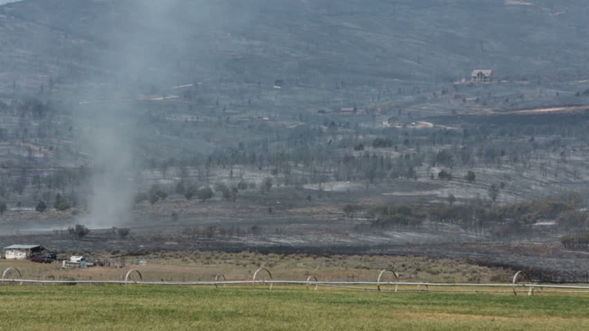 FOUNTAIN GREEN, SANPETE, UTAH 25 JUN 2012: Mountain wildfire tornado twister across burn. Fire intense flames out of control. Dangerous and destructive blaze. Wood Hollow Utah. FEMA. Drought winds.