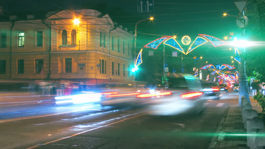 night city traffic on crossroad with festive illumination timelapse. Loopable, tags and logos are blurred, HD 1080p