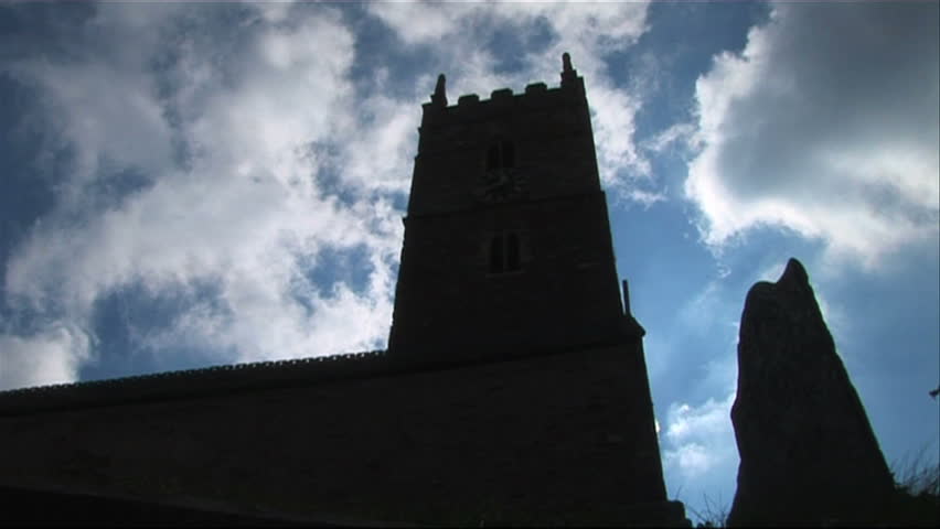 Silhouette of a church tower on a sunny day