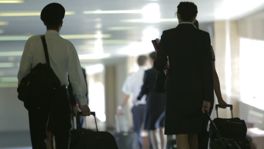 Pilots and flight attendants going in the plane