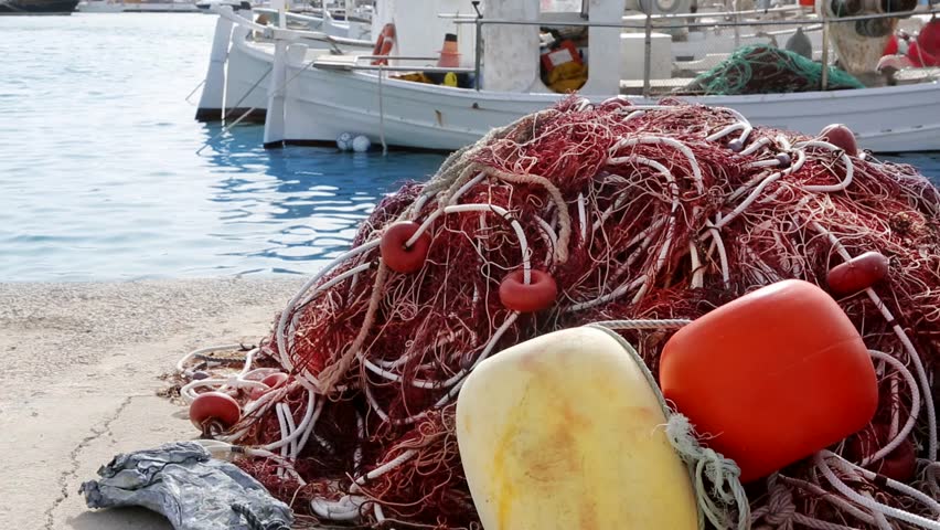 Balearic islands formentera port with trammel fisher nets buoys and fishingboats in background